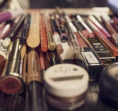 Make-up utensils lie on a table